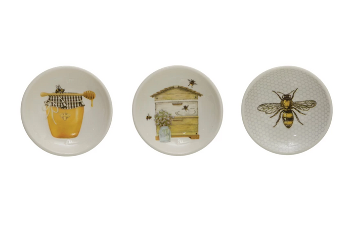 Stoneware dish with bees and honey